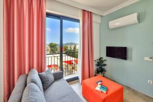 a living room with a couch and a large window at Joyy Suit Apart in Kas