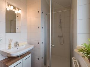 a bathroom with a sink and a shower at Ferienwohnung Eberharter in Hart im Zillertal