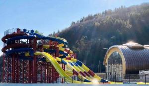 a water park with a roller coaster at Apartament Radu in Călimăneşti