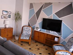 En TV eller et underholdningssystem på Apartamento Dayok Costa Barcelona