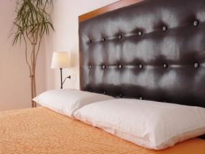 En eller flere senger på et rom på Apartamento Dayok Costa Barcelona