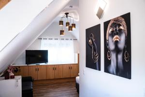 TV a/nebo společenská místnost v ubytování CityApartments Residence klimatisiert