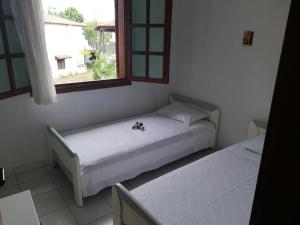 Ένα ή περισσότερα κρεβάτια σε δωμάτιο στο Archipelagos house