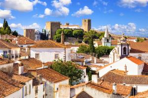 a view of the roofs of a town at Casa Senhoras Rainhas - Óbidos - by Unlock Hotels in Óbidos