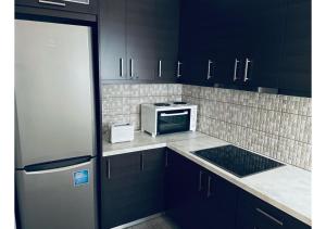Kuchyňa alebo kuchynka v ubytovaní Cozy Apartment in Central Athens - Sleeps 6