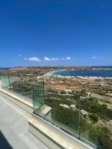 a view of the ocean from a building at Hotel VIU57 in Mellieħa