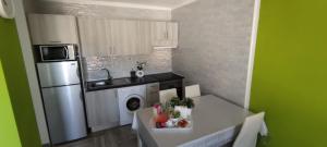 Køkken eller tekøkken på Residence Marineda Playa Cabezo