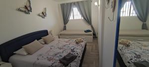 En eller flere senge i et værelse på Residence Marineda Playa Cabezo