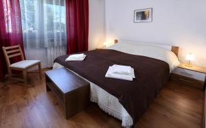 Ένα ή περισσότερα κρεβάτια σε δωμάτιο στο Apartman Lori