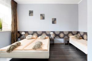 Posteľ alebo postele v izbe v ubytovaní Guesthouse Baltic