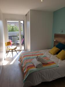 Postel nebo postele na pokoji v ubytování L'appartement JARDIN avec vue montagnes