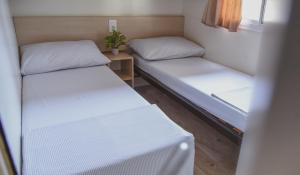 Postel nebo postele na pokoji v ubytování Mobile Homes Bilice