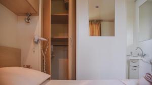 Postel nebo postele na pokoji v ubytování Mobile Homes Bilice
