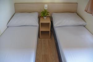 Postel nebo postele na pokoji v ubytování Mobile Homes Bilice