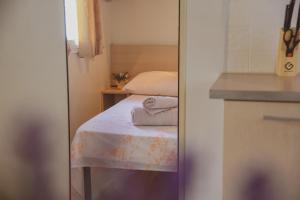 Postel nebo postele na pokoji v ubytování Mobile Homes Bilice