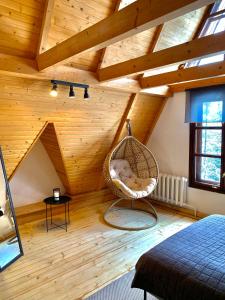 a room with a hammock in a attic at Sadyba Vanda in Oryavchyk