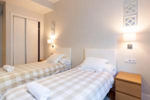 Ein Bett oder Betten in einem Zimmer der Unterkunft Urbe10 Angel Suites 2 Bedrooms Apartment 2A