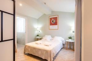 Postel nebo postele na pokoji v ubytování Urbe10 Angel Suites Apartment 4B