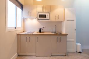 Kuchyňa alebo kuchynka v ubytovaní Urbe10 Angel Suites Apartment 4B