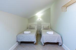 Posteľ alebo postele v izbe v ubytovaní Urbe10 Angel Suites Apartment 4B