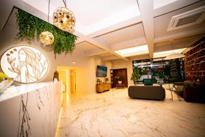 a lobby with a living room with a couch at Hotel Corina in Venus