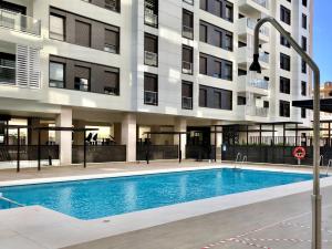 Bazén v ubytovaní GRETA PLAYA PANORAMA APARTAMENTO by AlohaMalaga alebo v jeho blízkosti