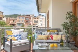 a balcony with two couches and a glass table at NEW! Villa Boutique Mallorca in Lloseta
