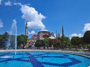 a fountain in front of a building with a mosque at The Sunrise Hotel in Istanbul