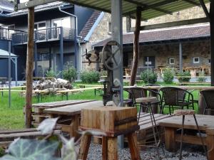 an outdoor patio with a table and a machine at Eventhotel Ö - Cappuccino in Geiselwind