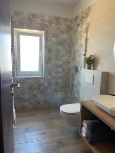 Kúpeľňa v ubytovaní Apartmani Žužić + 37 fotografií