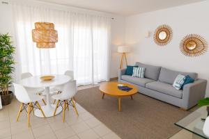 a living room with a couch and a table at Marina Club Lagos Resort in Lagos