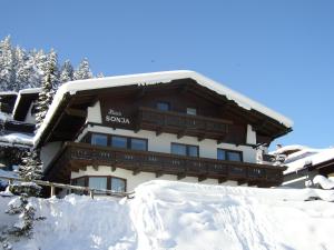 a snow covered building with a lot of snow at Haus Sonja in Seefeld in Tirol