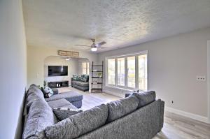 a living room with two couches and a tv at Bluefield Retreat with Pool Table Near Parks! in Bluefield