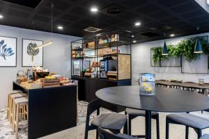 a dining room with a table and chairs at Staycity Aparthotels Bordeaux City Centre in Bordeaux