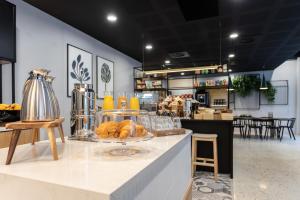 a bakery with a counter with pastries on it at Staycity Aparthotels Bordeaux City Centre in Bordeaux