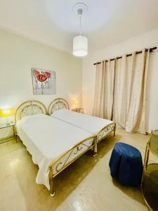 Postel nebo postele na pokoji v ubytování Kommeno Bay Apartments
