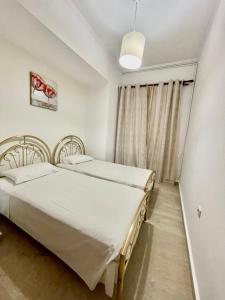Postel nebo postele na pokoji v ubytování Kommeno Bay Apartments