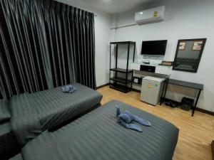 Wixky hotel客房内的一张或多张床位