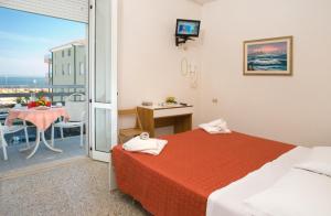 Postel nebo postele na pokoji v ubytování Hotel Ciondolo D'Oro + 37 fotografií