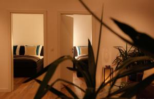 a living room with a couch and a mirror at Zugspitzloft in Ehrwald