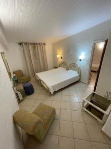 Postel nebo postele na pokoji v ubytování Kommeno Bay Apartments