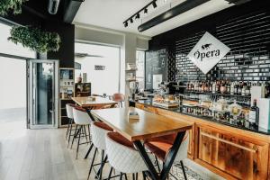 a restaurant with two tables and a bar at Urban Anaga Hotel in Santa Cruz de Tenerife