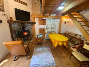 a living room with a couch and a fireplace at Altea Old Town Cottage in Altea