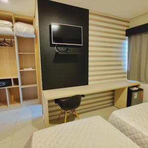 TV a/nebo společenská místnost v ubytování Mogano Express Hotel- ELETROPOSTO
