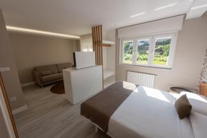 Postel nebo postele na pokoji v ubytování APARTAMENTOS CUME DO PINDO