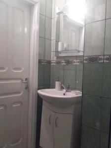 a bathroom with a sink and a mirror at Садиба "У стрийка" Сопіт in Sopot +85 photos