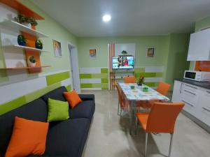 a living room with a blue couch and a table at El Hierro in Gran Tarajal