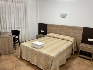 Posteľ alebo postele v izbe v ubytovaní Hostal Eden