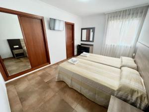 Posteľ alebo postele v izbe v ubytovaní Hostal Eden