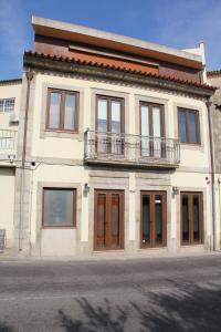 
a large building with a window on the side of it at Venceslau Wine Boutique Hostel in Vila do Conde

